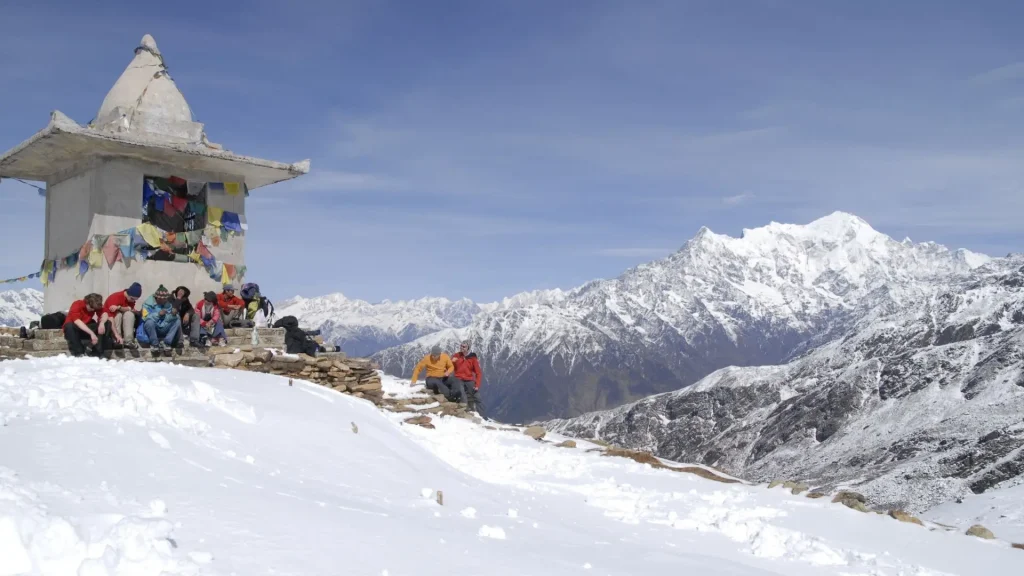 Colorful Tibetan Buddhist prayer flags along a high mountain trekking trail in the Langtang region, Nepal