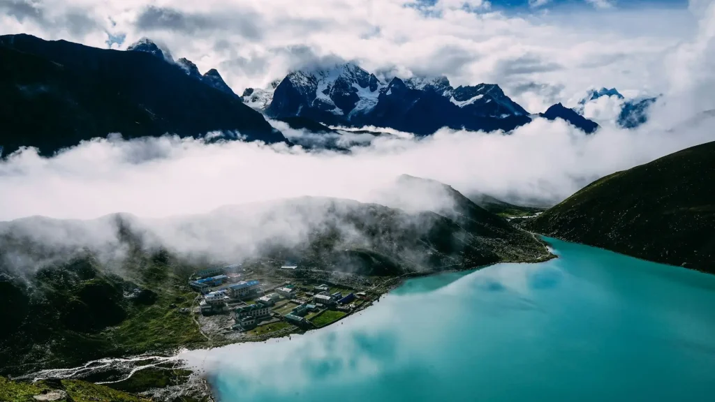Gokyo Lakes Trek Nepal with turquoise glacial lake and snow covered Himalayan mountains
