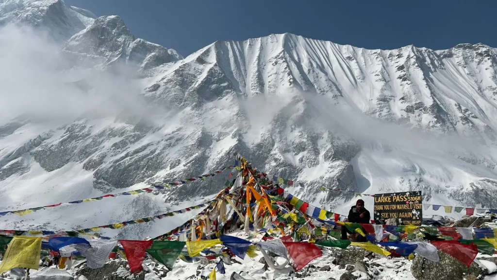 High altitude campsite surrounded by snowy Himalayan mountains on the Manaslu Circuit Trek