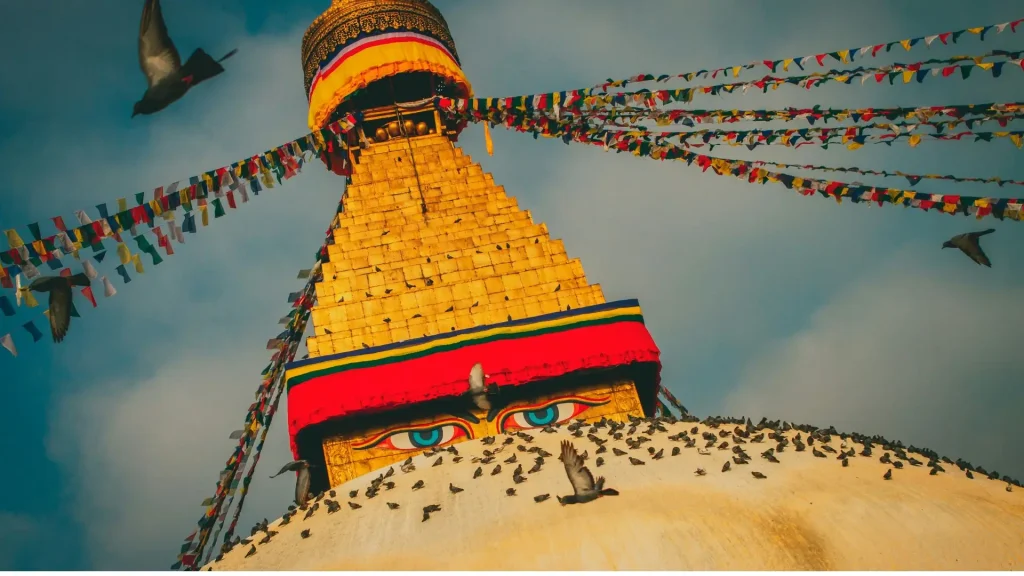 Panoramic view of Kathmandu Valley with prayer flags flying over Boudhanath Stupa