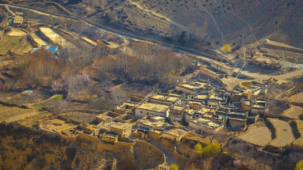 Traditional mountain village seen during Mustang trek Nepal surrounded by arid Himalayan landscape