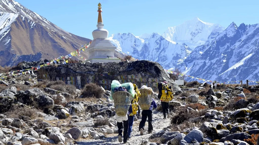 White Buddhist chorten with prayer flags along the Langtang Valley trek in Nepal