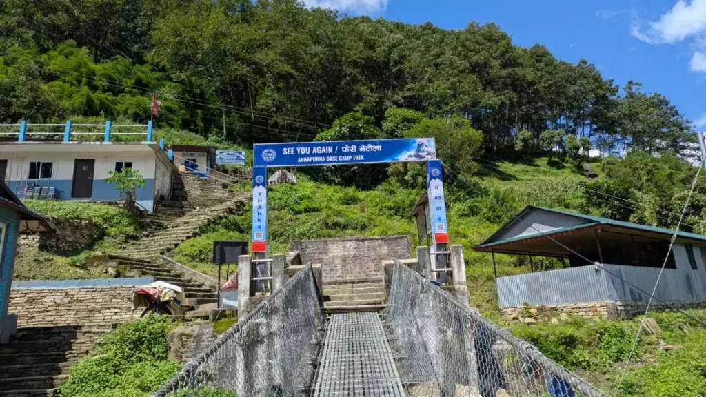 suspension bridge at annapurna region with gate of annapurna base camp trek