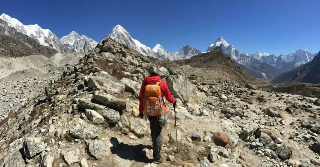 Hiker trekking through rugged terrain in the Annapurna region of Nepal